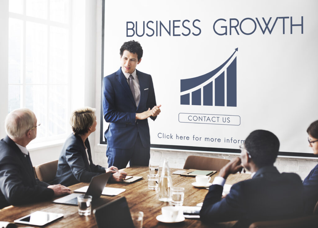 Business report with an upward profit graph representing growing revenue for entity structure planning