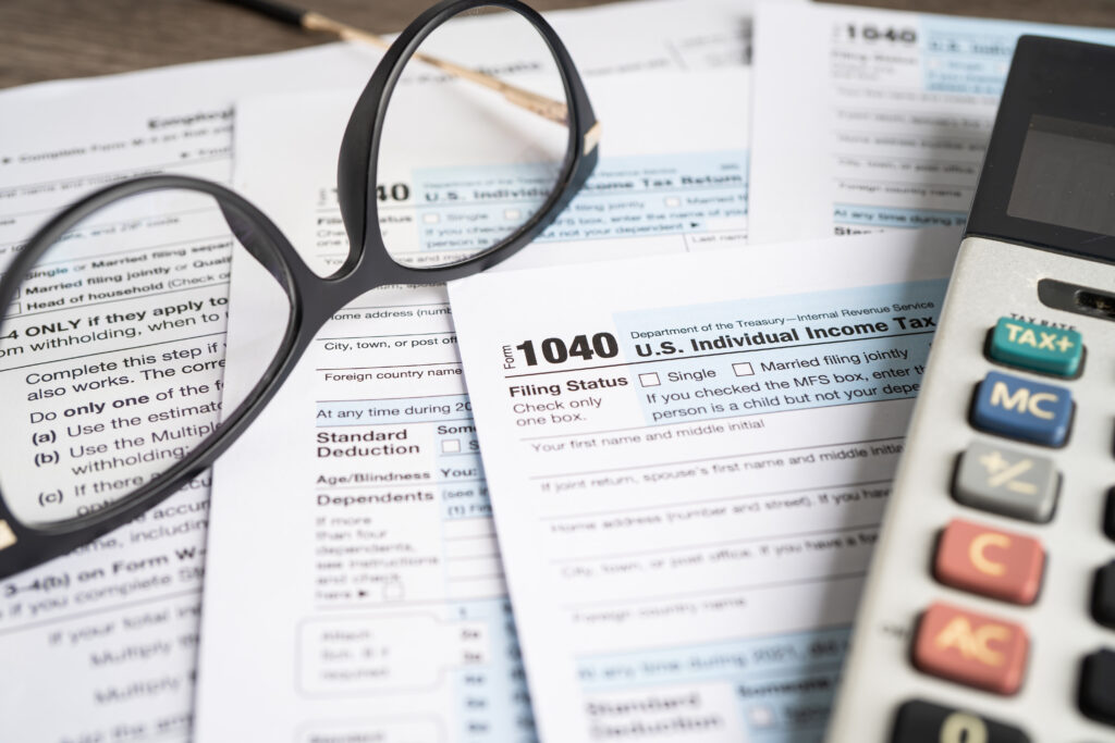IRS Form 1040 individual income tax return representing tax filing considerations for LLC and S corp owners