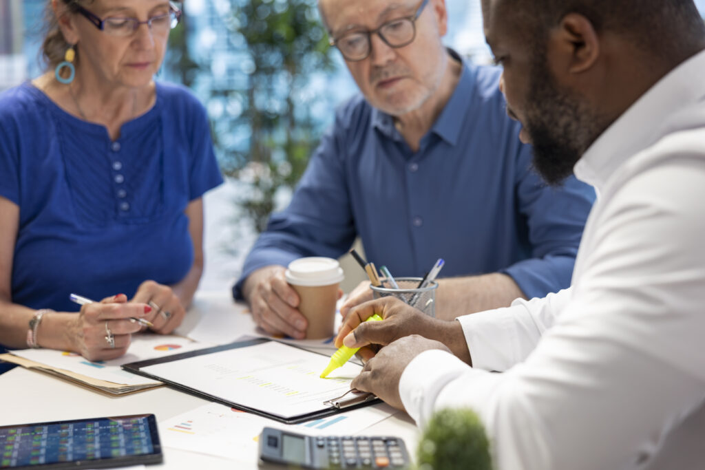 Financial advisor reviewing contract terms with a client during a tax planning consultation
