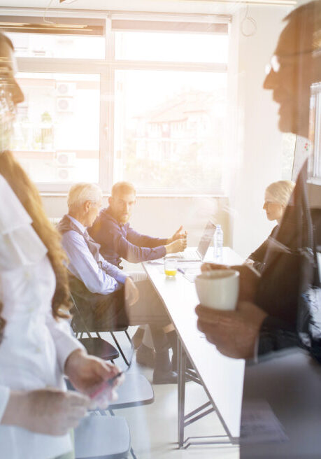 reflection-business-people-standing-front-his-colleague-meeting